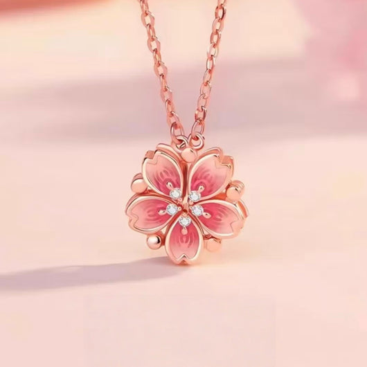 Auranudge Blossom Shift Kinetic Necklace in its folded peach blossom state, crafted from sterling silver.