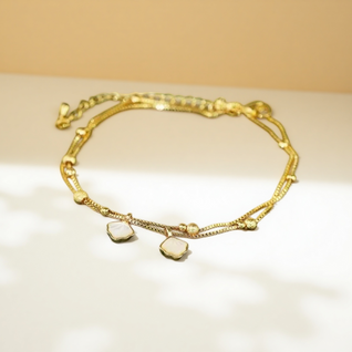 Oceanic Whisper: Layered Shell Anklet in Radiant Gold-Finish & Mother of Pearl